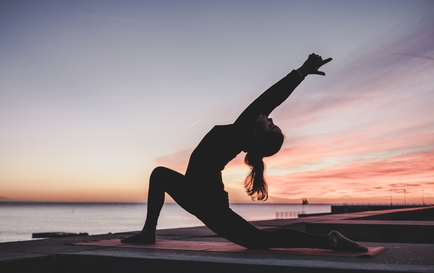 Athlete stretching during a lower-load training week